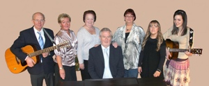 The Derryvolgie Singers.  L to R: Jim Hamilton, Liz Spence, Thelma Campbell, Karen McIvor, Emma-Louise Spence, Lindsay Hamilton and Graham Murphy (seated at piano).